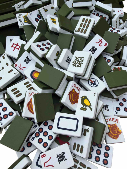 Collection of assorted Mahjong tiles on a dark background