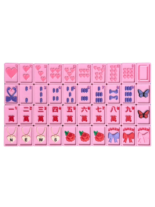 A set of pink rectangular Mahjong Tiles arranged in a grid on a white background, featuring various heart patterns, Chinese numerals, symbols, and small illustrations like butterflies, roses, bows, and necklaces.