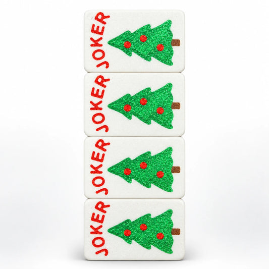 Four Spools mahjong joker tiles with sparkly green Christmas trees, red ornaments and red JOKER lettering, top view