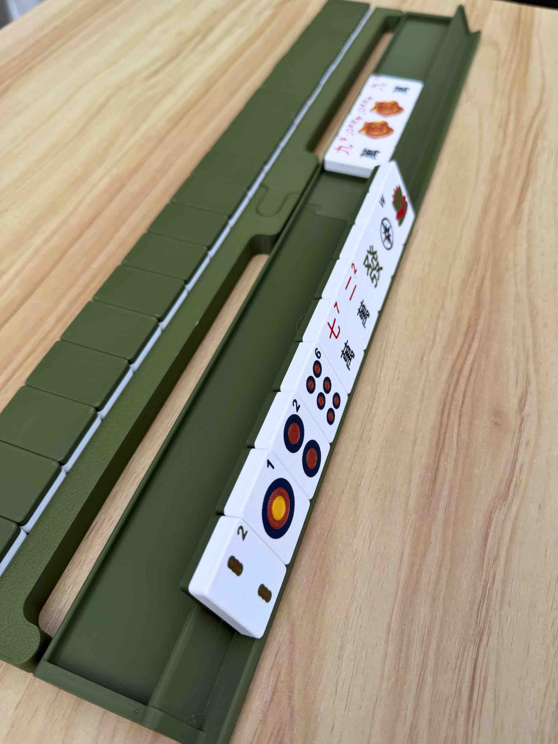 Travel Mahjong Racks, Pushers, and Tiles in a color coordinated wall
