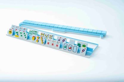 A light blue mahjong set with several tiles displayed in a long rack, photographed on a clean white background.