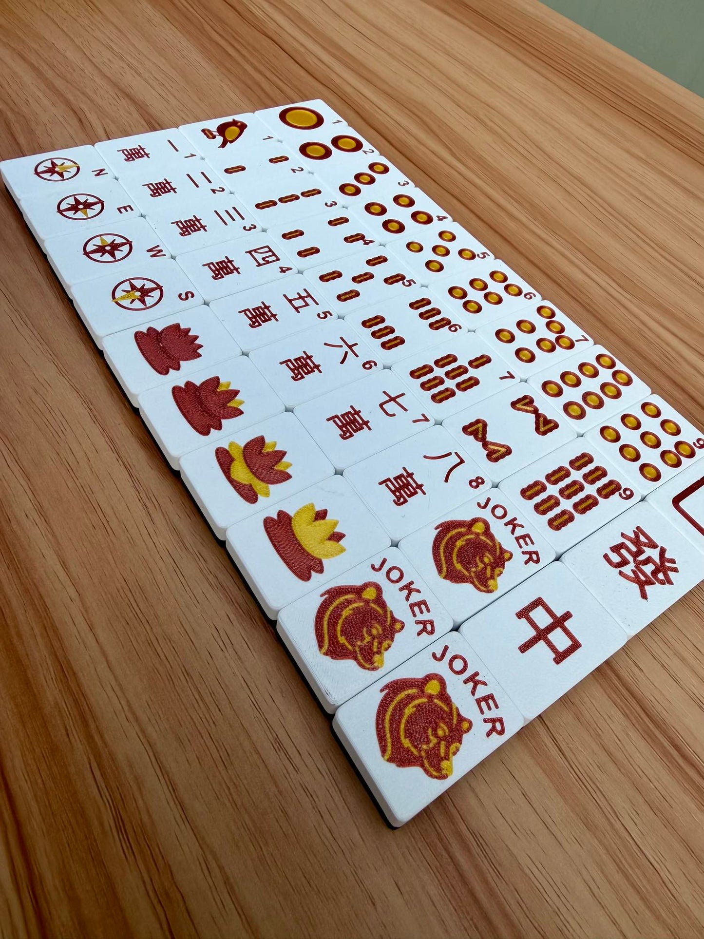 Maido board with red and yellow symbols on a wooden surface