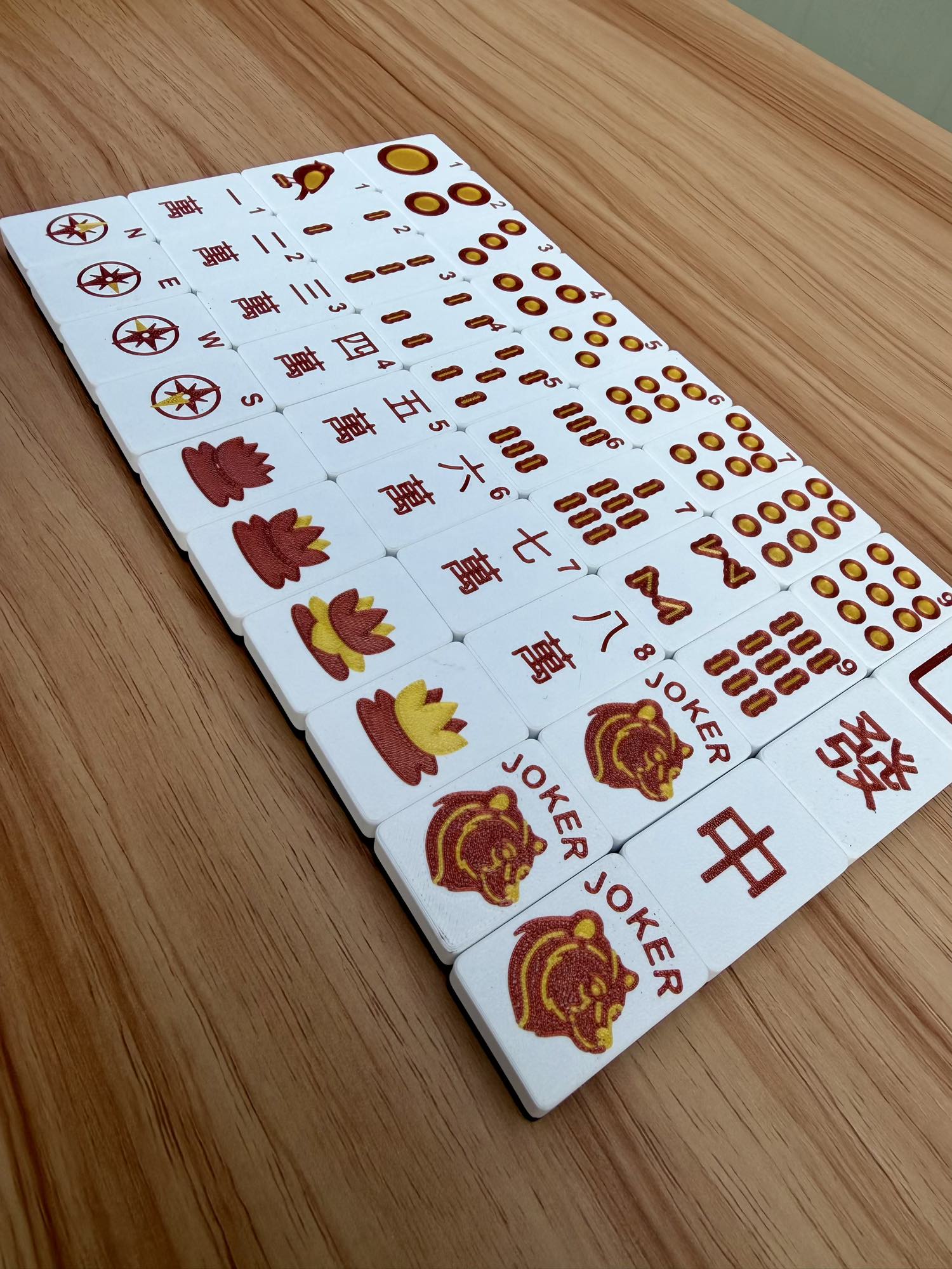 Maido board with red and yellow symbols on a wooden surface
