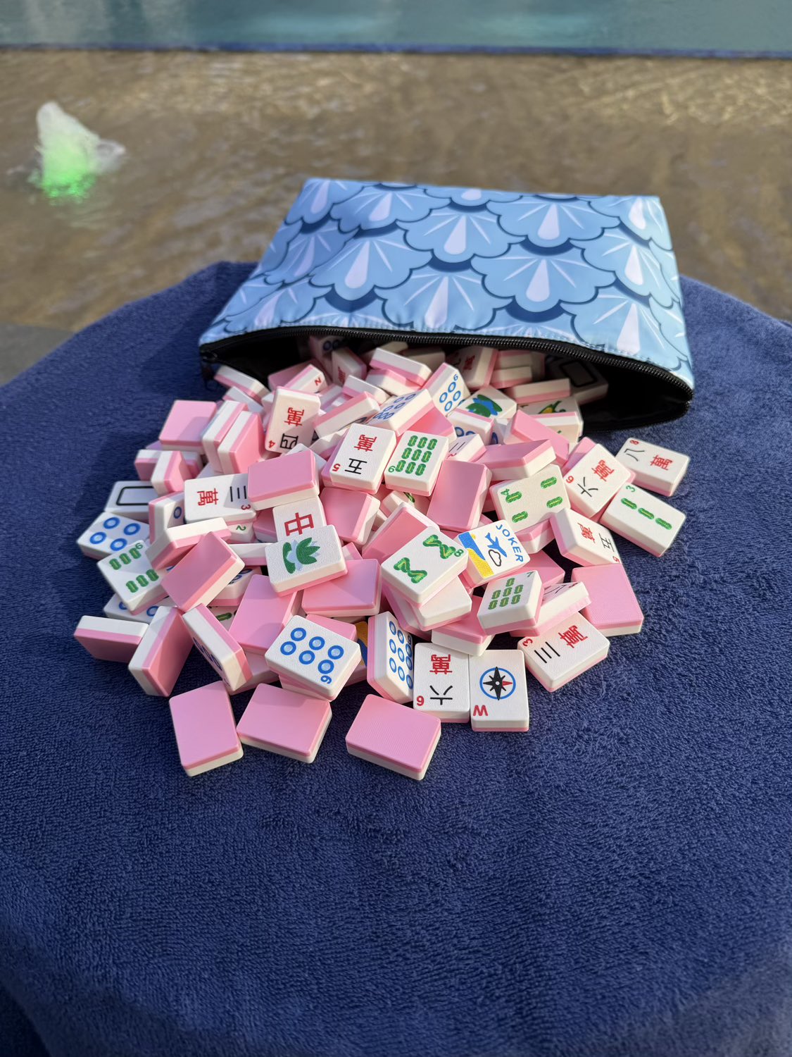 A Collection of Lightweight, Full Size Mahjong Tiles Spilling Out of a Bag