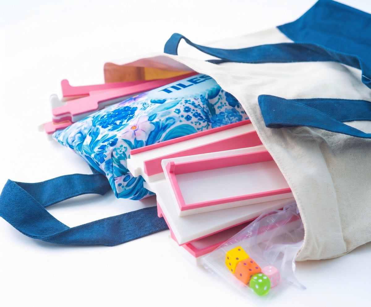 The Pink Mahjong Travel Bundle packed in a canvas tote