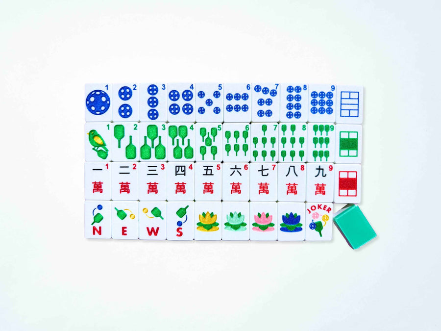 Full set of Spools Pickleball mahjong tiles laid out in rows, one tile back showing