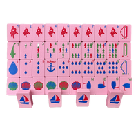 Set of pink mahjong travel tiles with a nautical theme.