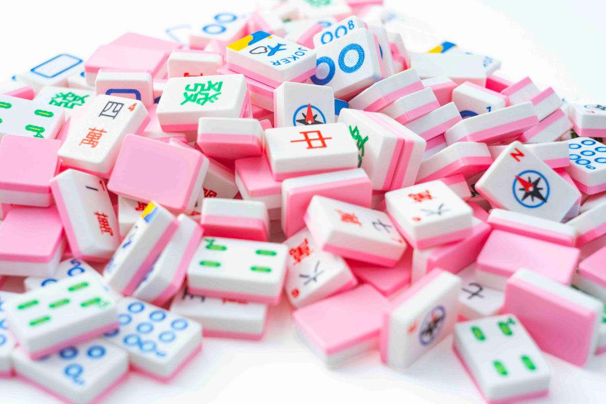 A set of pink poured out mahjong tiles.