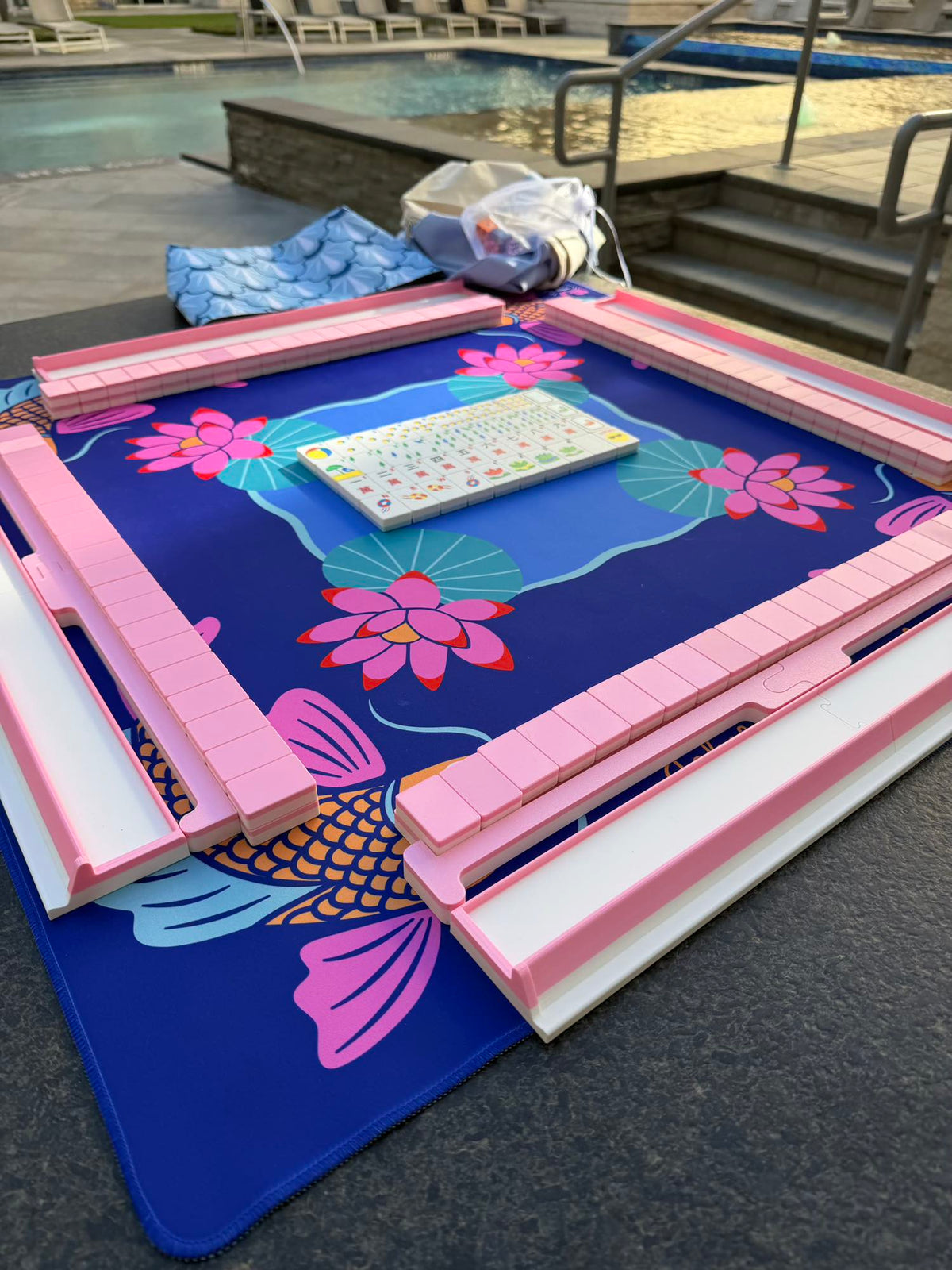 A Spools Pink Travel Mahjong Bundle by the Pool