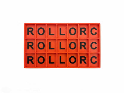 An orange-red rectangular tray with 18 individual compartments, each containing a black letter, arranged in three rows of six. The letters spell out 'ROLLORC' repeatedly across the compartments, set against a plain white background.