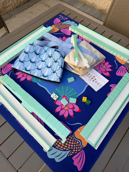 Spools Pickleball travel mahjong set fully arranged on a pickleball-themed mat with green racks and tiles.