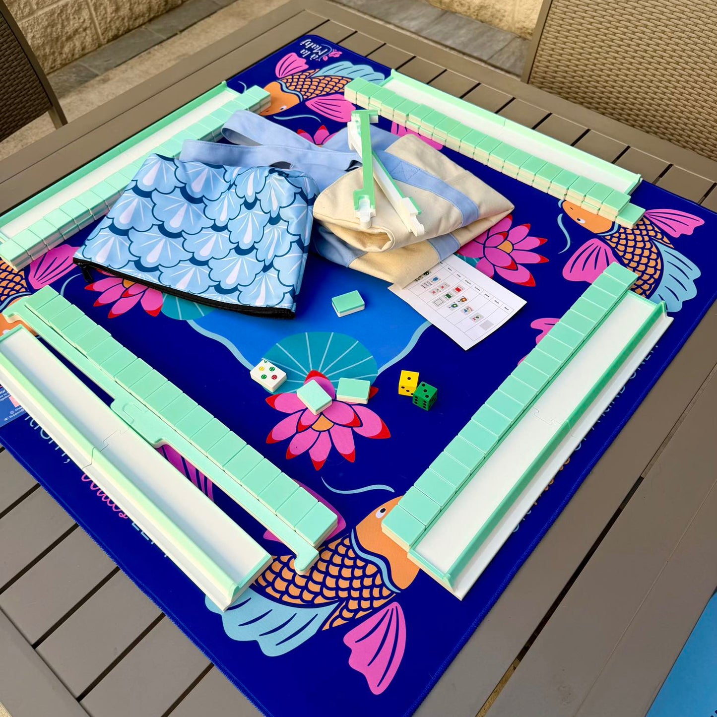 Spools Pickleball travel mahjong set with green racks and lightweight tiles arranged on a pickleball-themed playing mat.