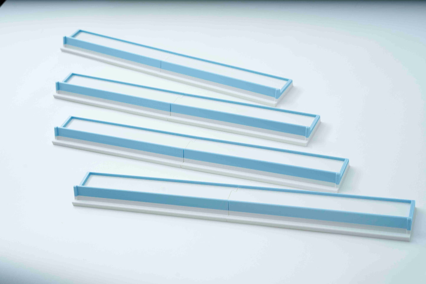 Four American Mahjong Racks that are a full 20 inches long but split in two for travel
