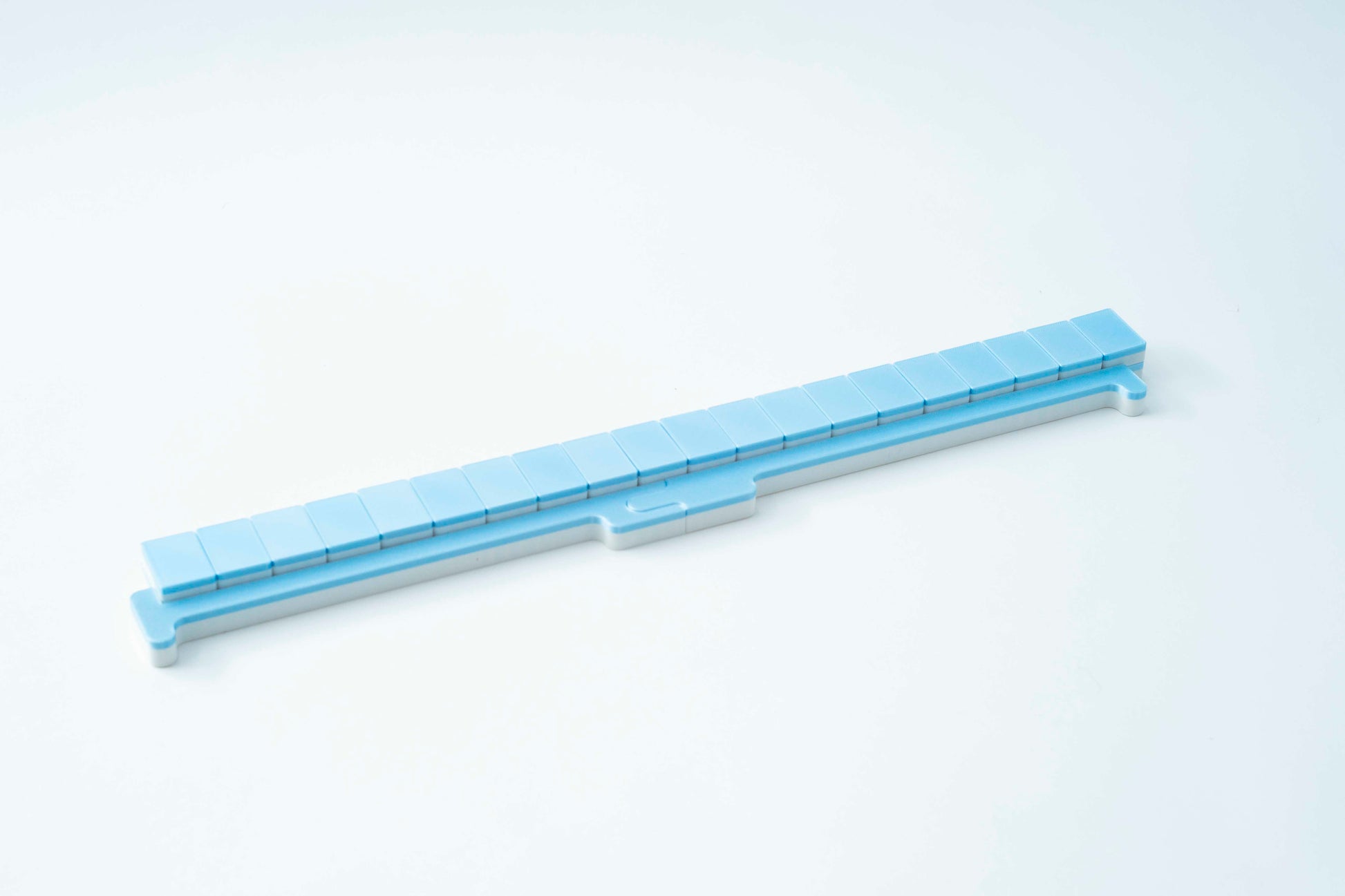A light blue travel mahjong pusher