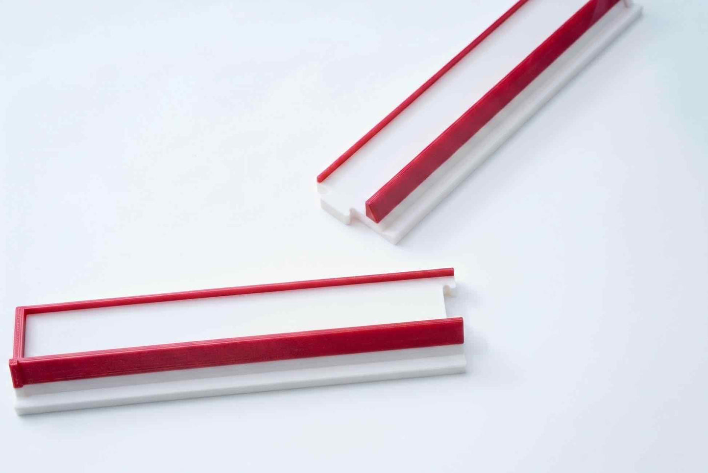 A set of white + red travel mahjong racks