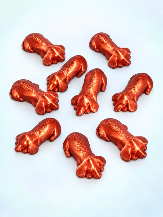 Copper sleeping dachshund mahjong trinkets, 3D printed by Spools