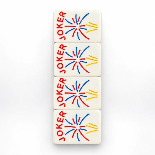 Four Spools mahjong joker tiles with red, blue and yellow firework bursts and red JOKER lettering, top view