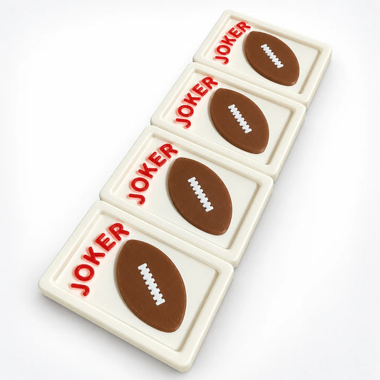 Four Spools mahjong joker tiles with raised 3D brown footballs and red JOKER lettering on cream tiles, angled view