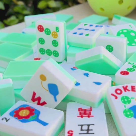 A video of a pickleball theme durable american mahjong travel tile being thrown