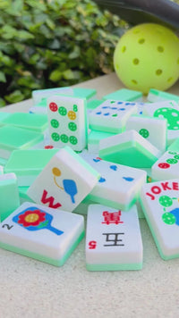 A video of a pickleball theme durable american mahjong travel tile being thrown