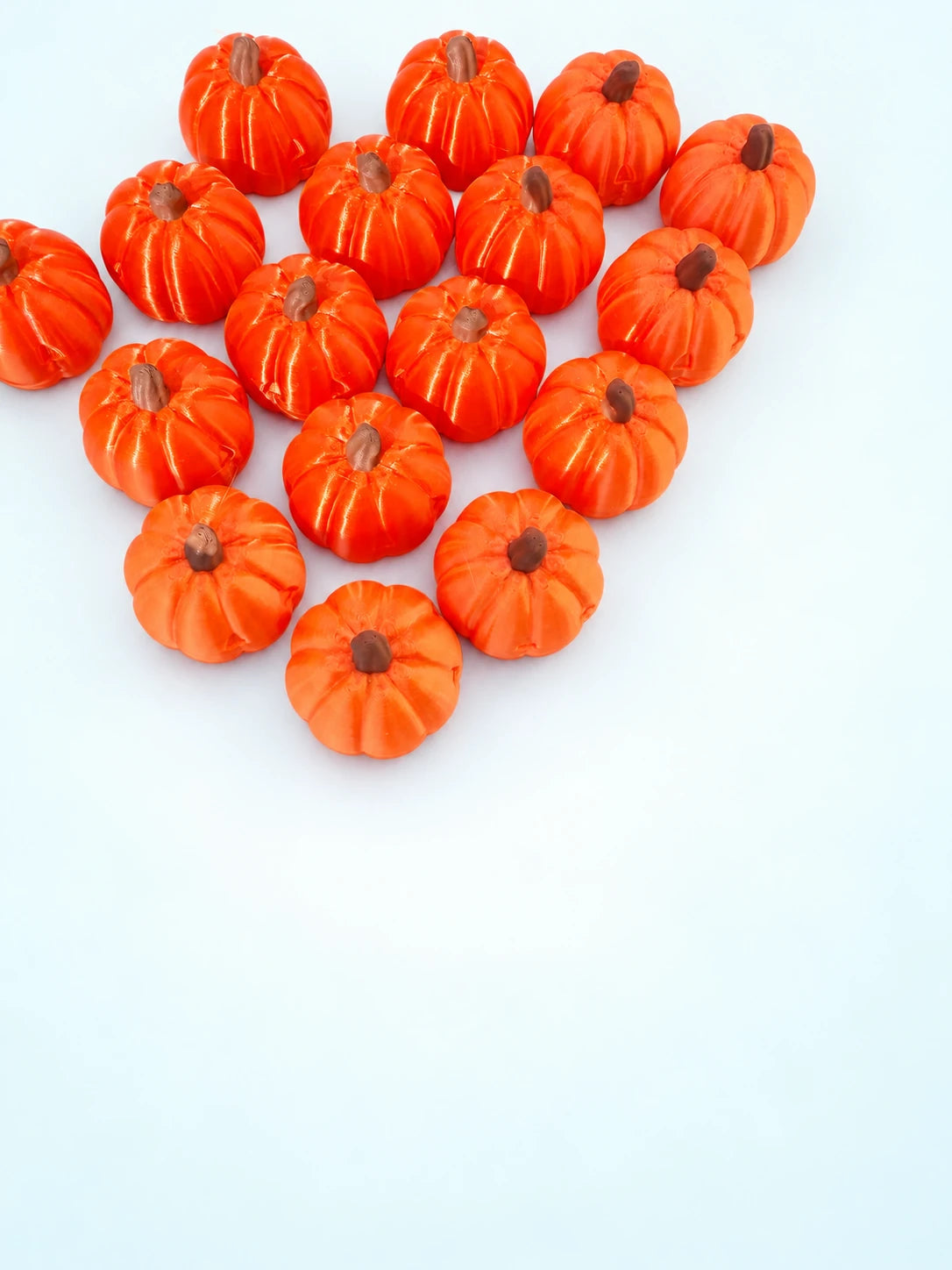 Pumpkin mahjong trinkets from Spools arranged on a white background
