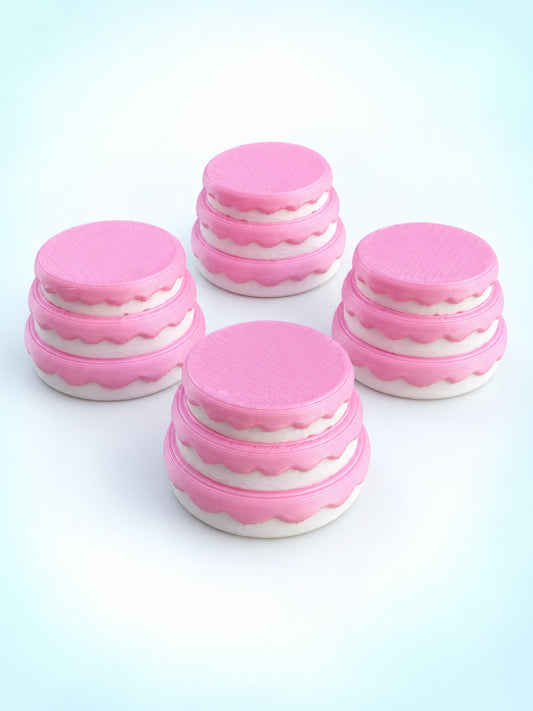 Four tiered pink and white cake mahjong trinkets with scalloped frosting, 3D printed by Spools