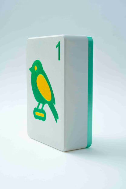 Spools mega mahjong tile display case with a mint green back and white face showing the 1 bam bird, on a light gray background